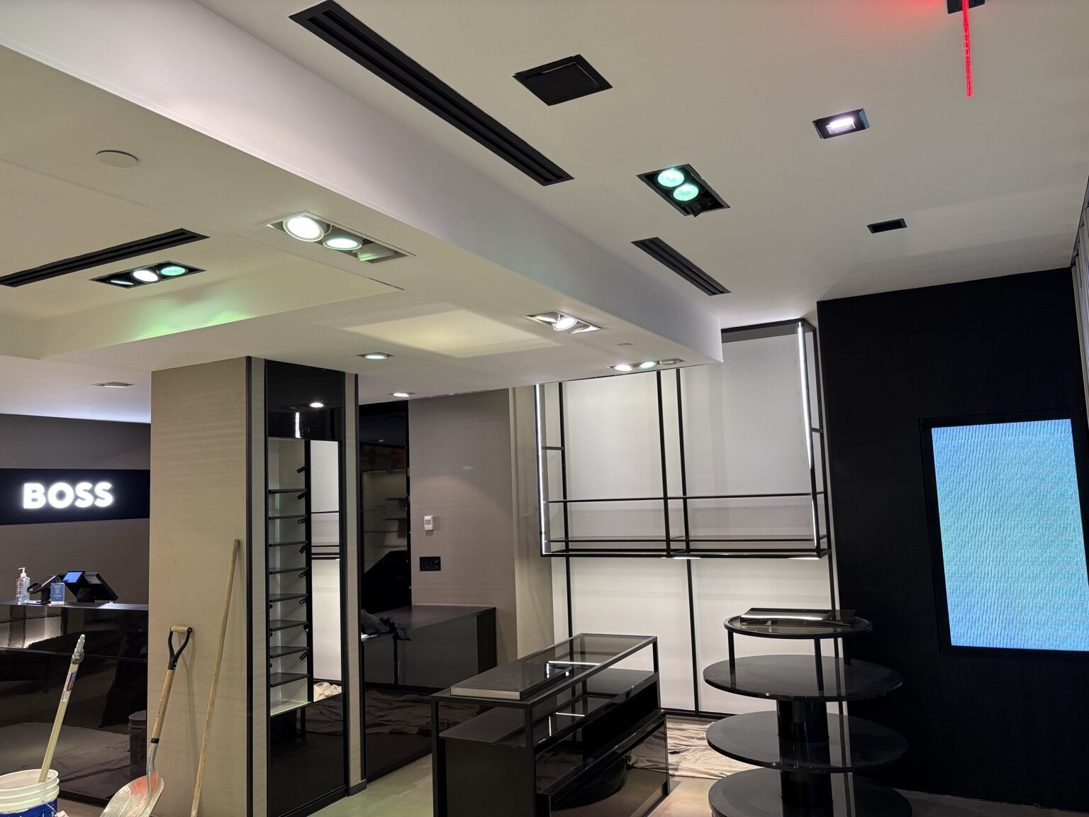 Completed BOSS store interior with bright ceilings and clean architectural details
