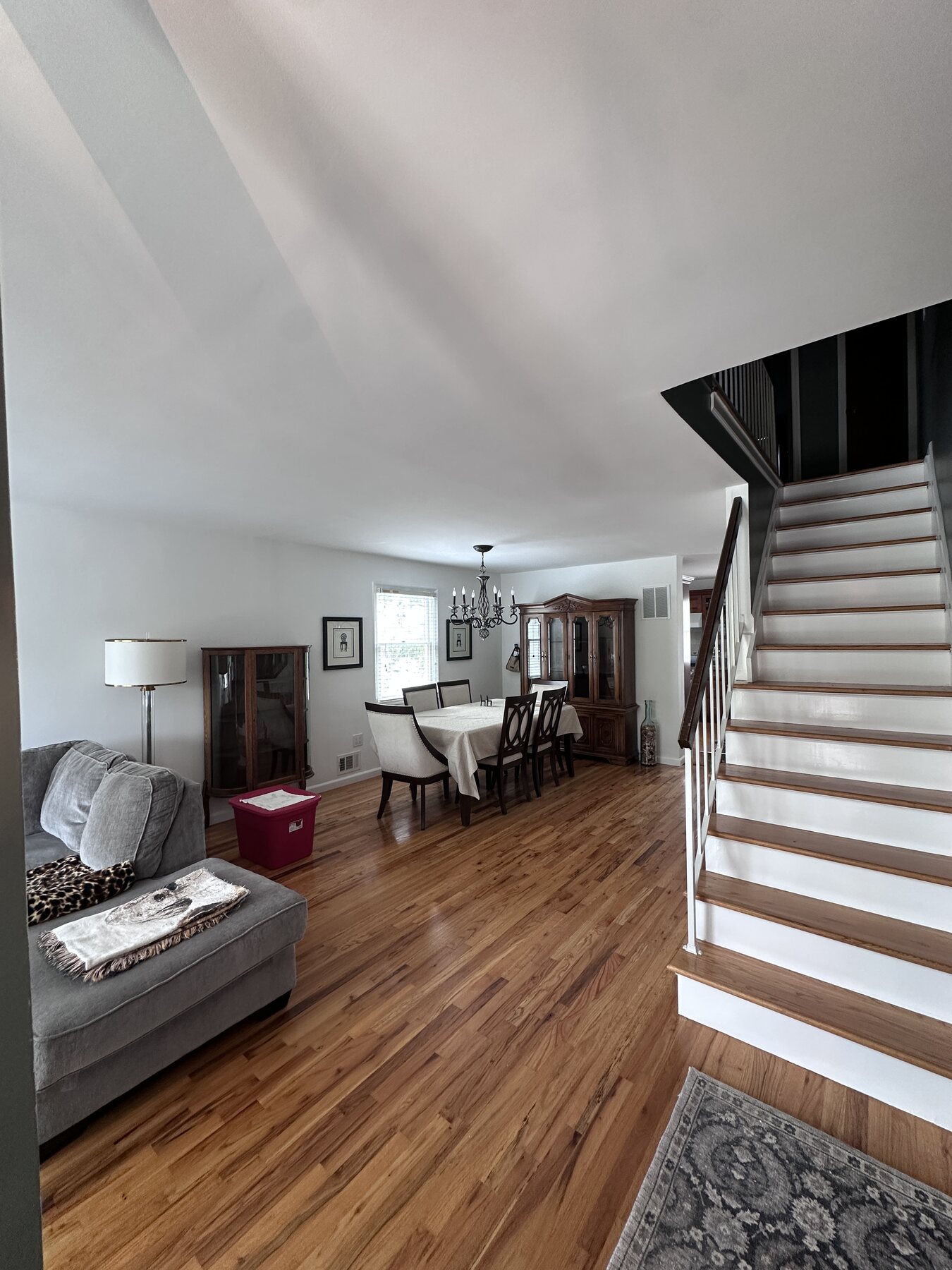 Completed residential living and dining room with freshly painted walls, ceiling, and trim